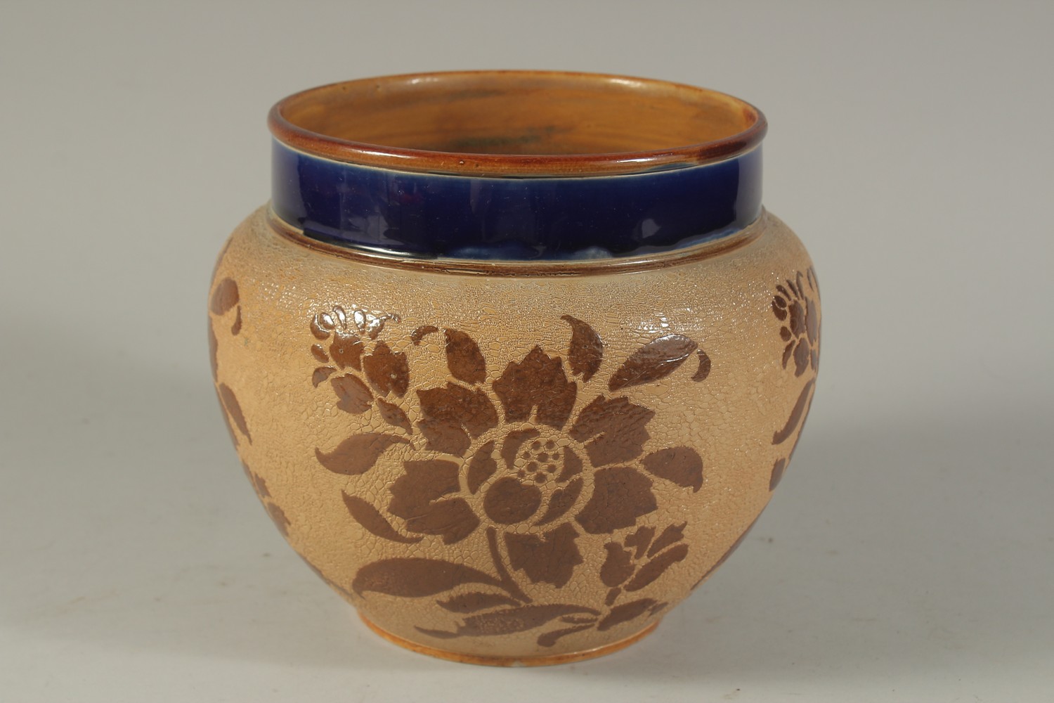 A ROYAL DOULTON SLATERS PATENT STONEWARE CIRCULAR JARDINIERE with blue rim, the body with leaves. - Image 2 of 5