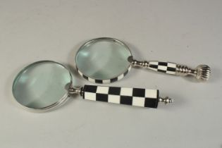 TWO MAGNIFYING GLASSES WITH CHECKER HANDLE.