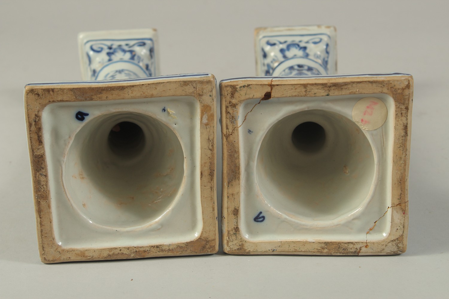 A PAIR OF DUTCH BLUE AND WHITE CANDLESTICKS on square bases. 10ins high. - Image 6 of 6