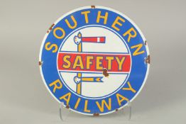 A CIRCULAR ENAMEL SIGN "SOUTHERN RAILWAY SAFETY". 12ins diameter.