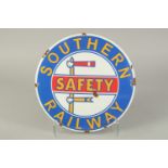 A CIRCULAR ENAMEL SIGN "SOUTHERN RAILWAY SAFETY". 12ins diameter.