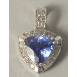 AN 18CT WHITE GOLD DIAMOND AND TANZANITE PENDANT