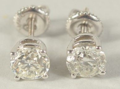 AN 18CT WHITE GOLD 1 CARAT EACH, DIAMOND STUD EARRINGS with screw fittings