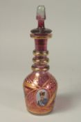 A GOOD RUSSIAN RUBY GLASS DECANTER AND STOPPER with gilt decoration and and oval portrait of a