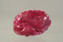 A CHINESE CARVED TOURMALINE FISH CARVING. 7cms x 4.5cms.