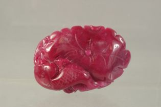 A CHINESE CARVED TOURMALINE FISH CARVING. 7cms x 4.5cms.