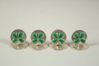 A SET OF FOUR S. MORDAN & Co. SILVER AND GREEN ENAMEL IRISH MENU HOLDERS, decorated with enamel