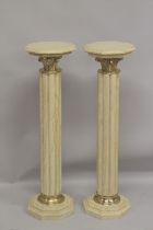 A PAIR OF BEIGE MARBLE CLUSTER COLUMNS with gilt metal mounts. 3ft 4ins high.