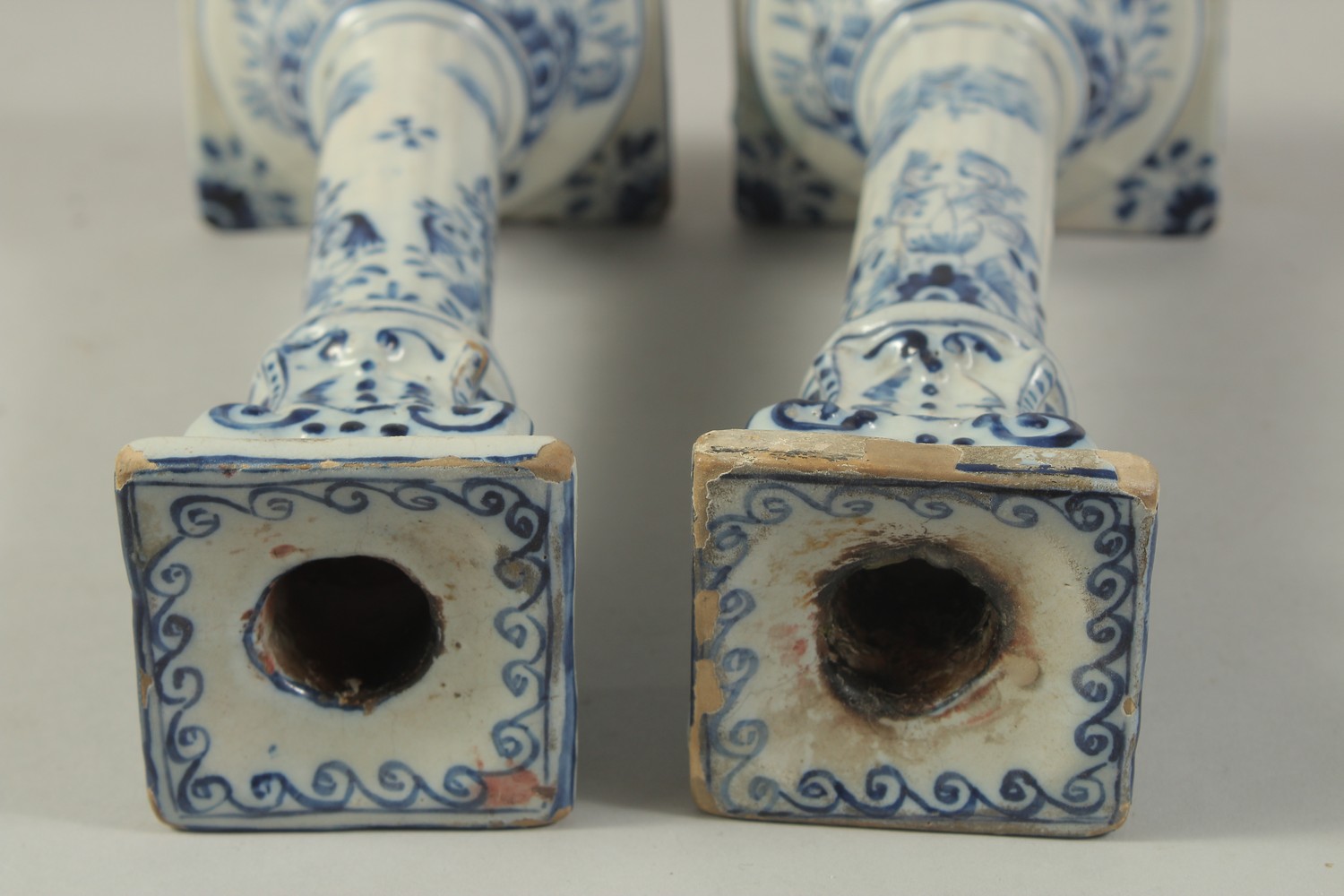 A PAIR OF DUTCH BLUE AND WHITE CANDLESTICKS on square bases. 10ins high. - Image 5 of 6