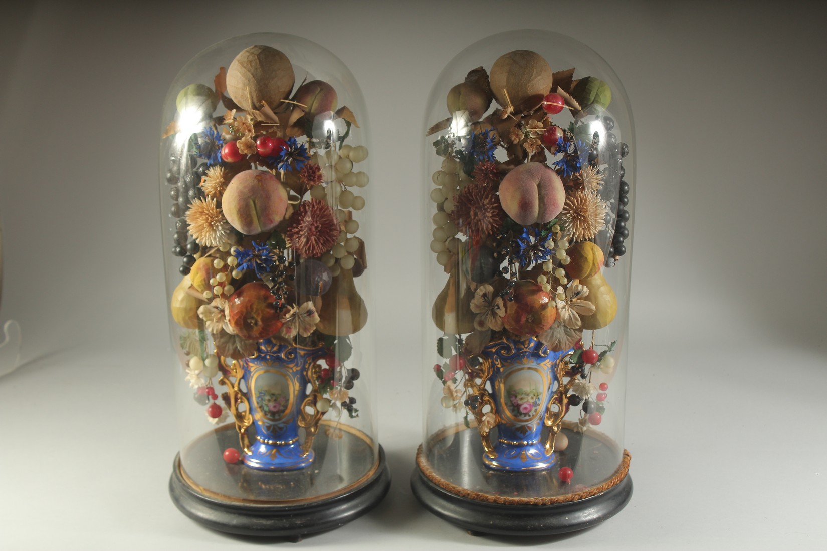 A VERY GOOD PAIR OF VICTORIAN GLASS DOMES, WAX FRUIT in a vase. 23ins overall. - Image 4 of 4