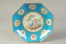AN 18TH CENTURY SEVRES OCTAGONAL DISH, painted with birds in a landscape, surrounded by eight