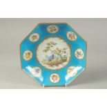 AN 18TH CENTURY SEVRES OCTAGONAL DISH, painted with birds in a landscape, surrounded by eight