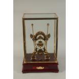 A GOOD GRASSHOPPER CLOCK in a glass case. 22ins high.