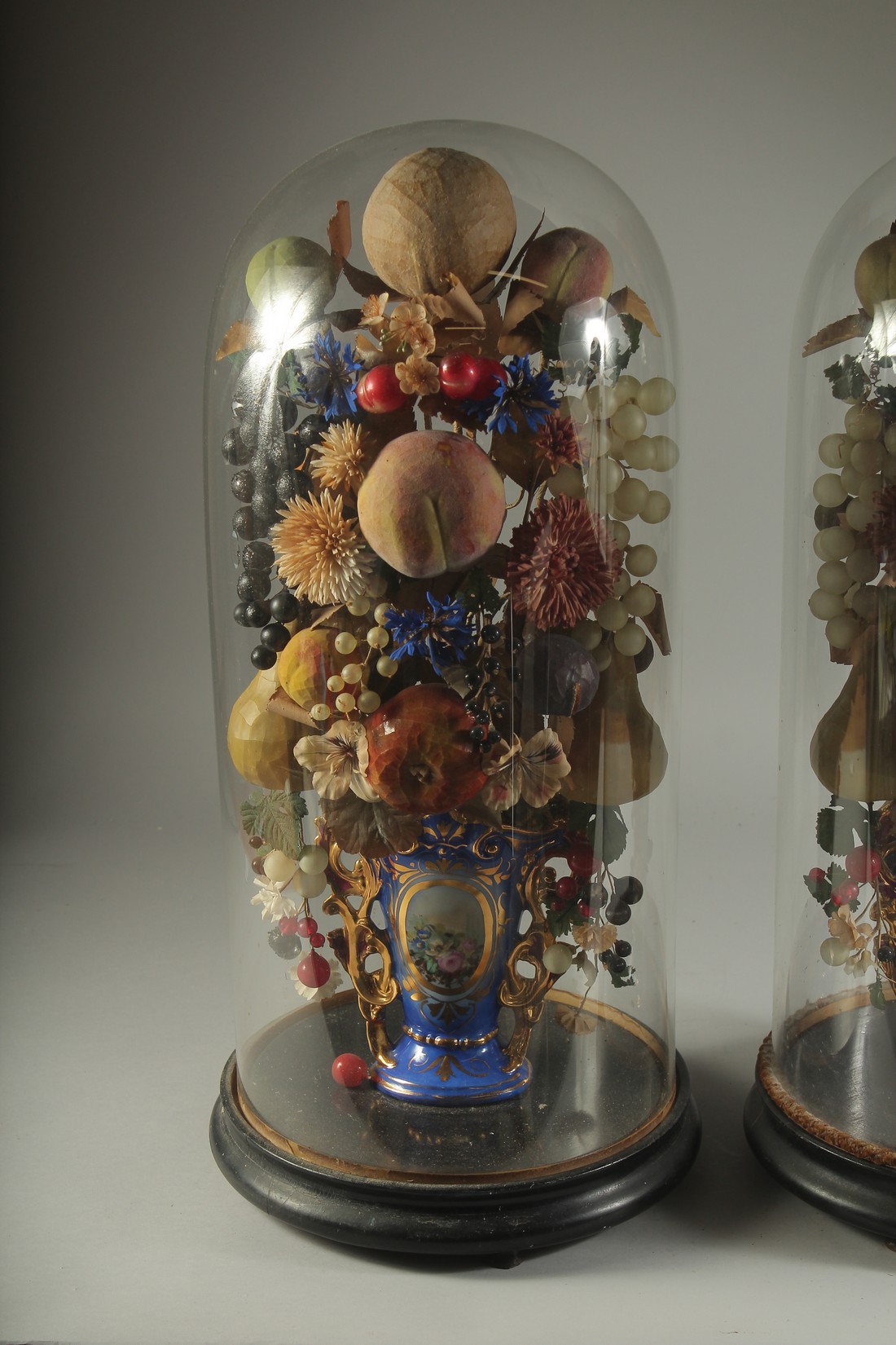A VERY GOOD PAIR OF VICTORIAN GLASS DOMES, WAX FRUIT in a vase. 23ins overall. - Image 2 of 4