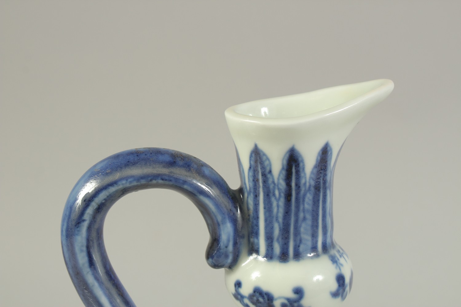 A CHINESE BLUE AND WHITE PORCELAIN EWER, with a band of carved floral decoration. 29cms high. - Image 5 of 6