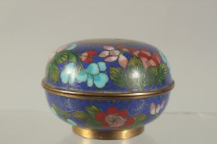 A ROUND CLOISONNE BOX AND COVER. 3.5ins diameter.