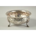 A WEST AND SON SILVER CIRCULAR SUGAR BOWL with repousse decoration, on three pad feet. 5ins