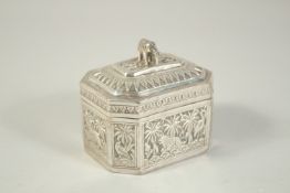 A SRI LANKAN SILVER METAL BOX AND COVER with animals and palm trees. 3.5ins.