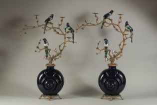 A PAIR OF DARK BLUE MULTI BIRD CANDLESTICKS with birds and flowers. 25ins high.