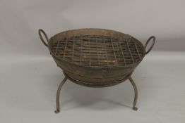 A CIRCULAR IRON FIRE PIT ON STAND. 2ft diameter.