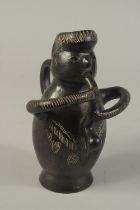 AN UNUSUAL PRE-COLUMBIAN MOCHE BLACK WARE FIGURAL VESSEL. 8.5ins high.