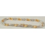 AN 18CT GOLD DIAMOND BRACELET set wit brilliant cut diamonds