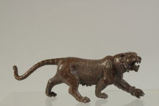 A JAPANESE BRONZE TIGER. 16cms long.