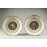 A PAIR OF 18TH CENTURY CIRCULAR PORTRAIT PLATES of Queens. 10.5ins diameter.