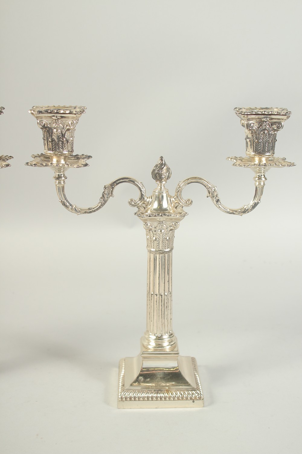 A GOOD PAIR OF TWO BRANCH SILVER CANDLESTICKS with coloums on square bases. 12ins high. London - Image 3 of 6