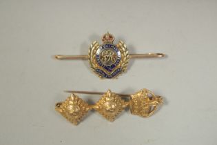 A ROYAL ENGINEERS GOLD AND BLUE ENAMEL BROOCH AND ANOTHER, THREE PIPS. (2).