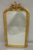 A GOOD GILTWOOD MIRROR with birds and flowers. 5ft high x 2ft 7ins wide.