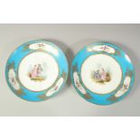 A PAIR OF 18TH CENTURY SEVRES CIRCULAR PORCELAIN PLATES, the blue borders decorated in gilt, with