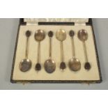 A SET OF SIX BEAN END COFFEE SPOONS with enamel bowls, cased.