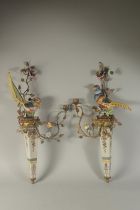 A GOOD PAIR OF MULTI COLOUR PORCELAIN AND GILT METAL WALL SCONCES.