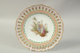 A MEISSEN OPENWORK PLATE with a scene of lovers, after Watteau. Circa. 1785. 23.5cm diameter.