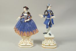 A PAIR OF MEISSEN PILGRIMS, the shell signifying the pligrimage to Santiago Compostela, Spain.