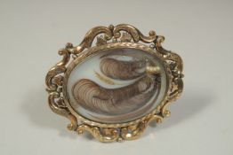 A VICTORIAN BROOCH inset with hair and seed pearls. Inscribed and dated ,1847.