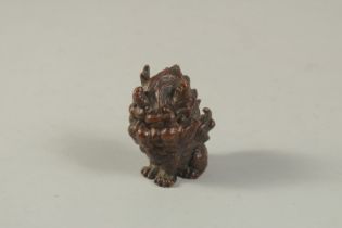 A BRONZE OKIMONO of a Mythical Beast. 6cms high.