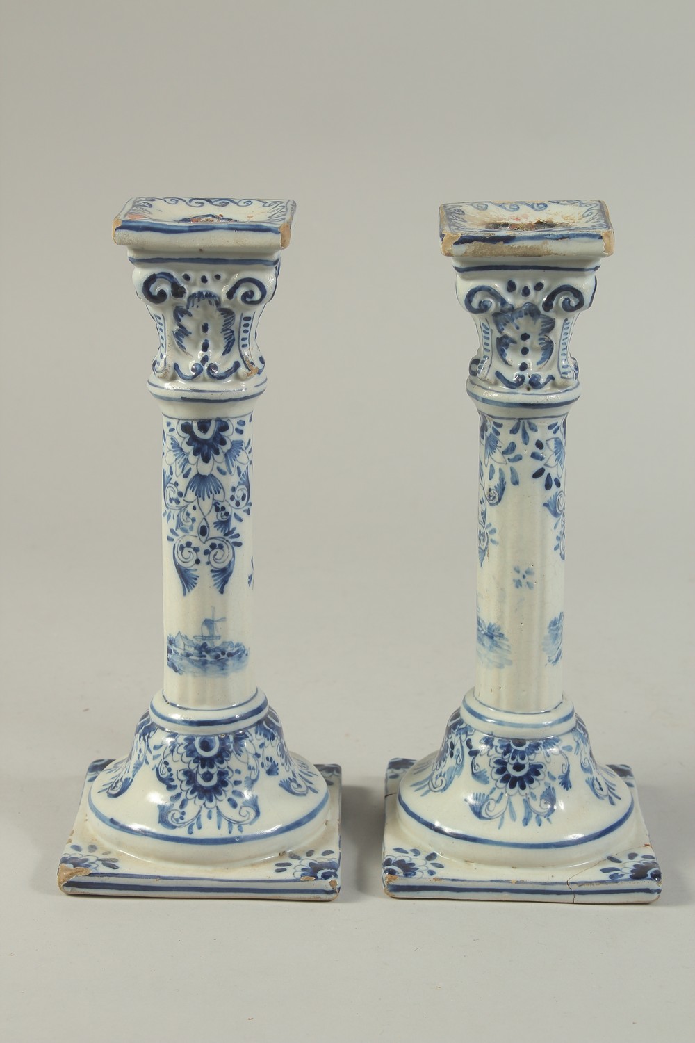 A PAIR OF DUTCH BLUE AND WHITE CANDLESTICKS on square bases. 10ins high. - Image 3 of 6