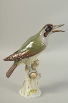 A MEISSEN GREEN WOODPECKER first modelled by Joachim Kaendler. Circa. 1880. 26.5cm tall. Cross