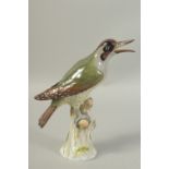 A MEISSEN GREEN WOODPECKER first modelled by Joachim Kaendler. Circa. 1880. 26.5cm tall. Cross