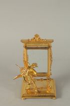 A GOOD GILT BRONZE WINGED CUPID MIRROR. 9ins high.