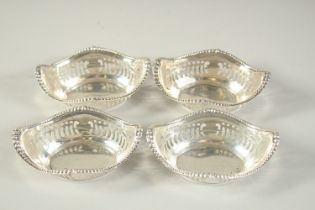 A SET OF FOUR OVAL PIERCED SILVER BON BON DISHES. 3.25ins long. Birmingham 1928.