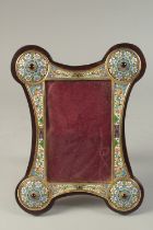 A GOOD RUSSIAN SILVER AND ENAMEL SHAPED PHOTOGRAPH FRAME. 24cms x 18cms.