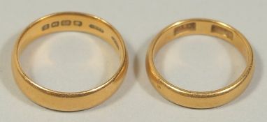 TWO 22CT GOLD WEDDING BANDS. Weight: 9gms.