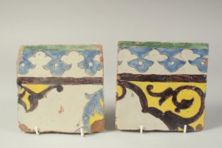 TWO EARLY 19TH CENTURY PERSIAN QAJAR GLAZED POTTERY TILES, 16cm x 16.5cm each, (2).