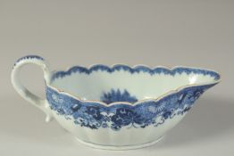 A CHINESE QIANLONG PERIOD BLUE AND WHITE PORCELAIN SAUCE BOAT, the interior painted with a fishing