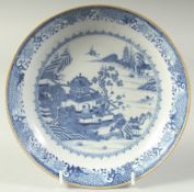 AN 18TH CENTURY CHINESE BLUE AND WHITE PORCELAIN DISH, decorated with a temple within a landscape