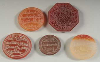 A COLLECTION OF FIVE ISLAMIC ENGRAVED AGATE SEALS, some with Kufic calligraphy, (5).