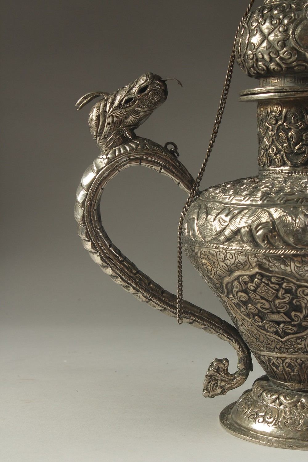 A LARGE CHINESE EMBOSSED AND ENGRAVED WHITE METAL LIDDED JUG, possibly low grade silver, decorated - Image 9 of 14